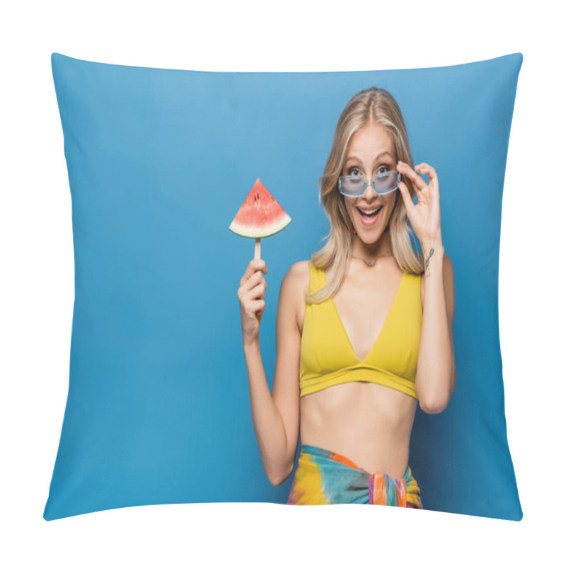 Personality  Cheerful Young Woman In Bikini Top Adjusting Sunglasses And Holding Popsicle Stick With Watermelon Isolated On Blue Pillow Covers