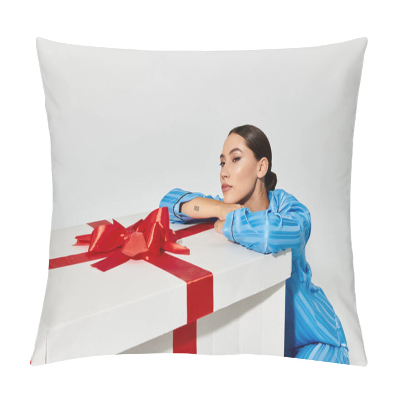 Personality  A Stylish Young Woman Leans On A Large Gift Box, Showcasing Elegance And Charm. Pillow Covers