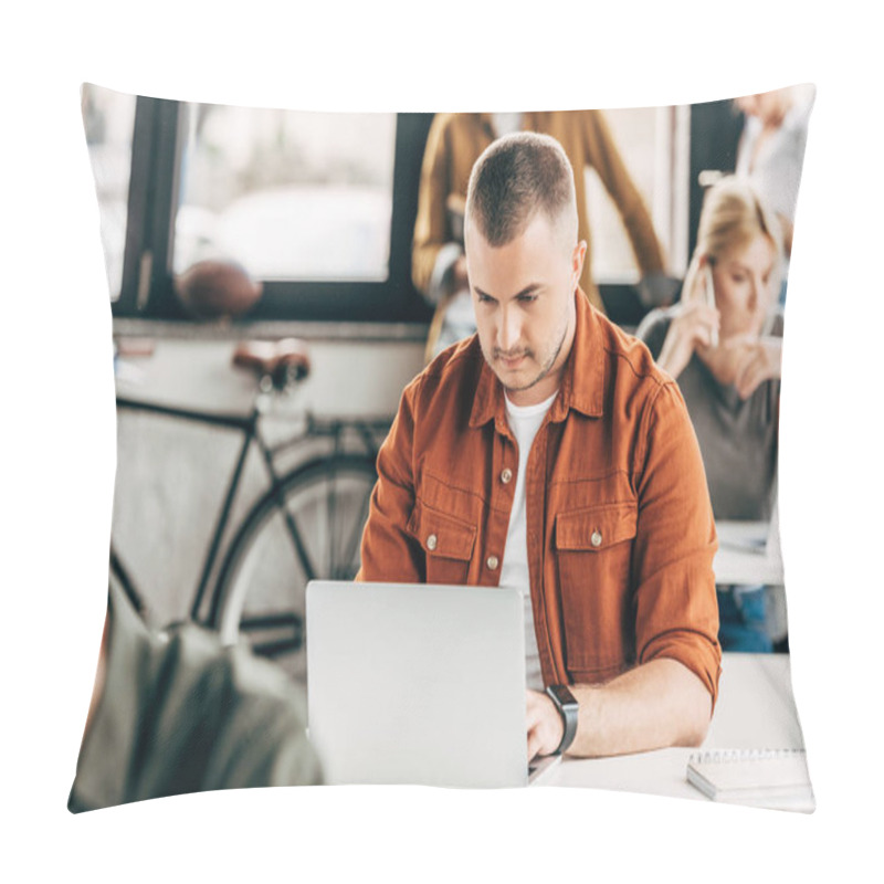 Personality  Attractive Young Man Working With Laptop At Open Space Office With Colleagues On Background Pillow Covers