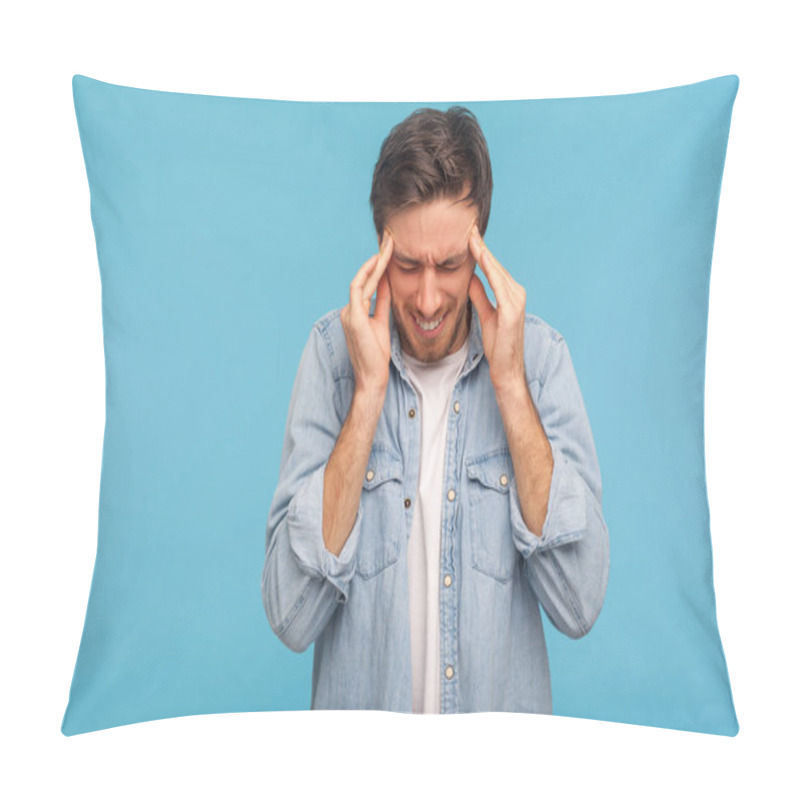 Personality  Portrait Of Frustrated Unhealthy Man In Denim Shirt Pressing Fingers To Temples, Feeling Sick And Suffering Severe Headache, Migraine Of Stress, Tension. Indoor Studio Shot Isolated On Blue Background Pillow Covers