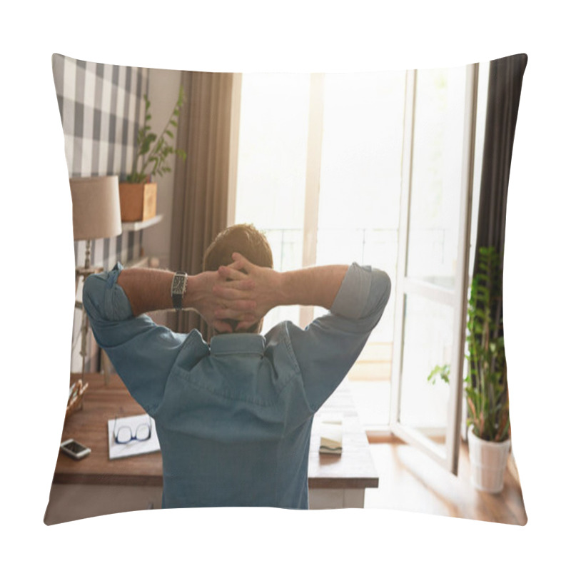 Personality  Rear View Of Man Leaning Back In His Chair With His Hands Behind His Head, While Working At Table In His Apartment With Sun Flare Pillow Covers