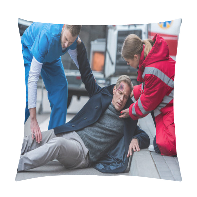 Personality  Young Male And Female Paramedics Helping Injured Man On The Street Pillow Covers