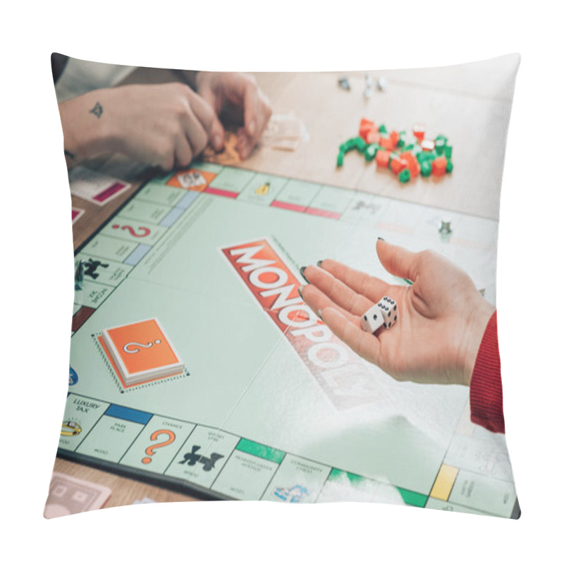 Personality  KYIV, UKRAINE - NOVEMBER 15, 2019: Cropped View Of Woman Playing Monopoly Game At Table Pillow Covers