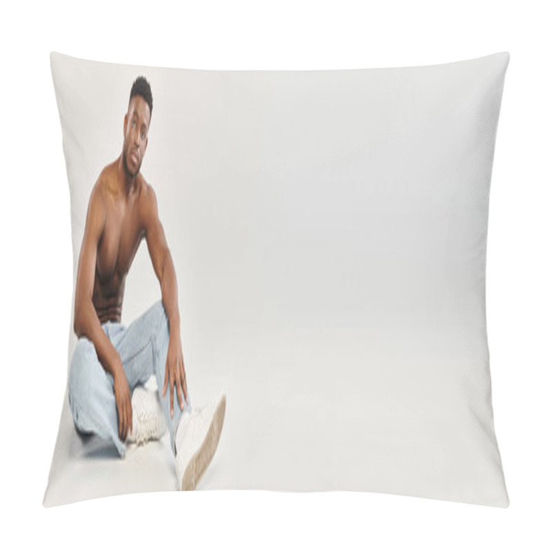 Personality  A Shirtless Young African American Man Sits Contemplatively On The Ground In A Studio, Against A Grey Background. Pillow Covers