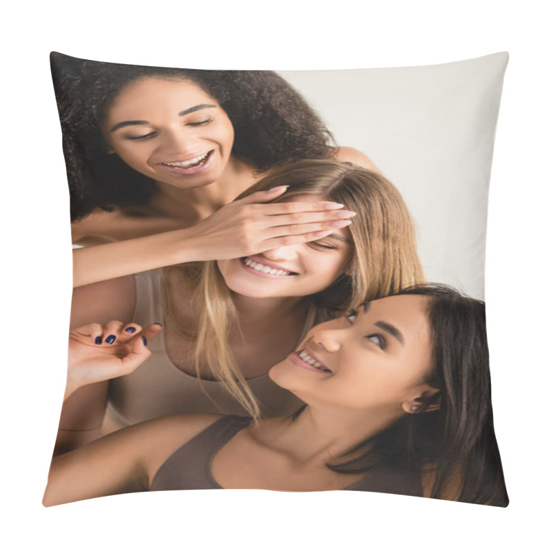 Personality  Happy African American Woman Covering Eye Of Cheerful Model Near Asian Friend Isolated On White Pillow Covers