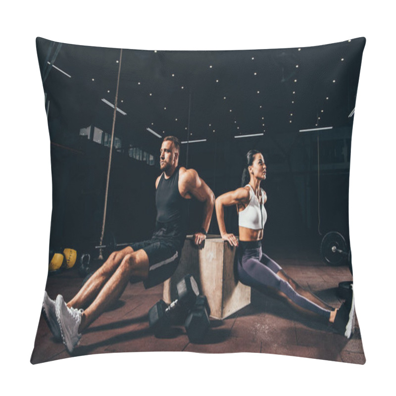 Personality  Athletic Sportsman And Sportswoman Exercising On Cube Together In Dark Gym Pillow Covers