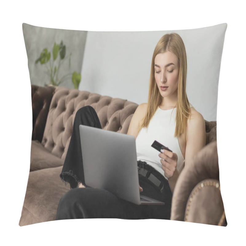 Personality  Blonde Woman In Top Holding Credit Card And Using Laptop On Comfortable Couch  Pillow Covers