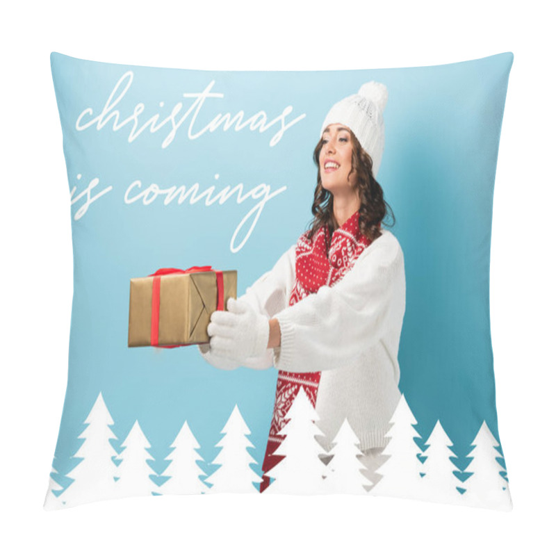 Personality  Young Pleased Woman In Winter Outfit With Outstretched Hands Holding Wrapped Present Near Christmas Is Coming Lettering On Blue Pillow Covers