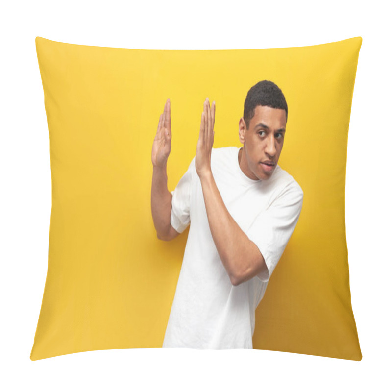 Personality  Young Afro American Guy In White T-shirt Avoids And Refuses With His Hands On Yellow Background, The Man Pulls Back, The Man Defends Himself And Says No Pillow Covers