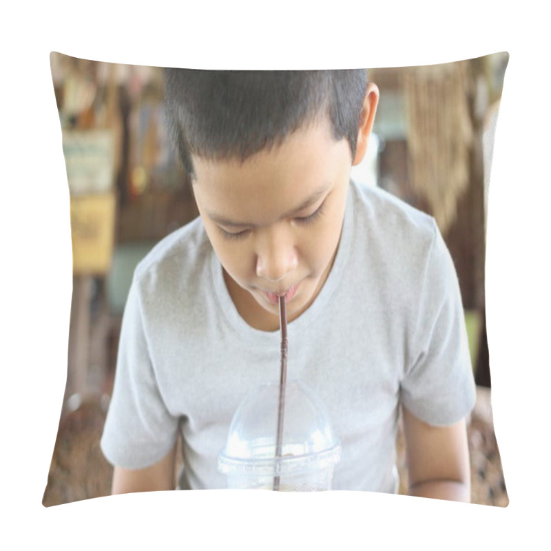 Personality  A Young Boy Sits Indoors, Sipping A Refreshing Drink Through A Straw. The Cozy Atmosphere Highlights Childhood Joy And Simple Pleasures Of Summer. Pillow Covers