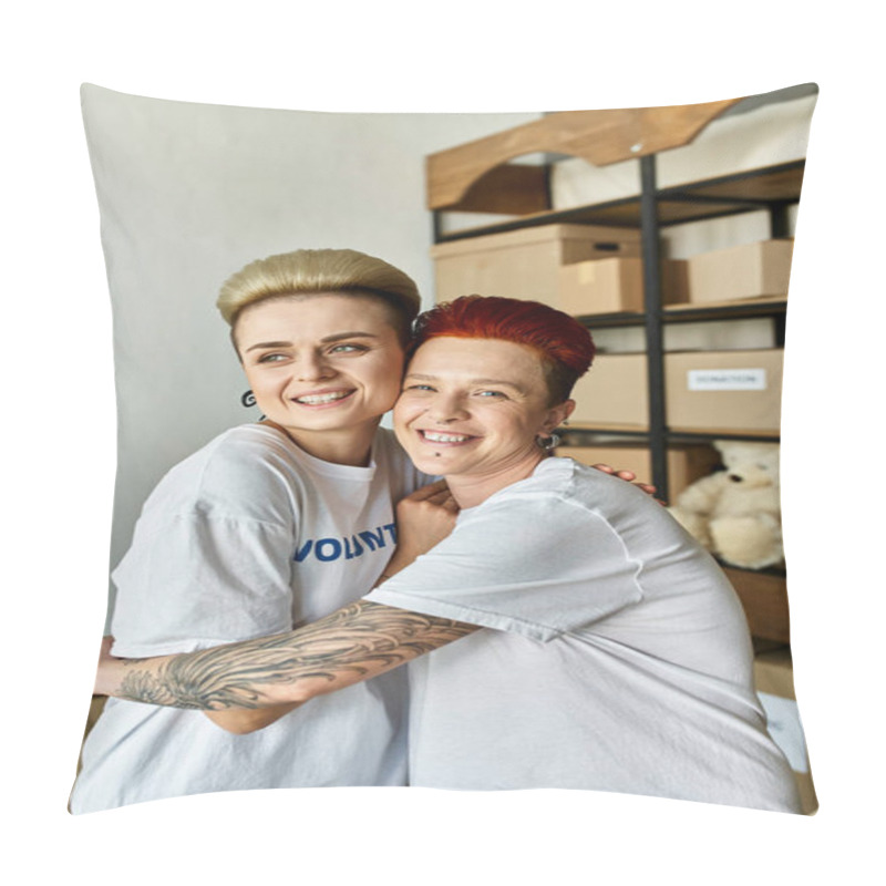 Personality  A Woman Lovingly Hugs Another In A Room, Both Wearing Volunteer T-shirts. A Heartwarming Moment Of Connection. Pillow Covers