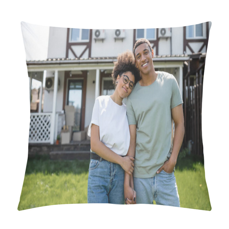 Personality  Happy African American Couple Holding Hands And Looking At Camera Near New House On Background Pillow Covers