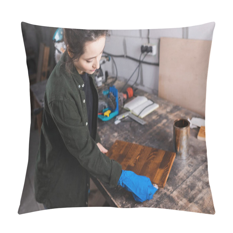 Personality  Brunette Craftswoman Applying Wood Stain On Board In Blurred Workshop  Pillow Covers