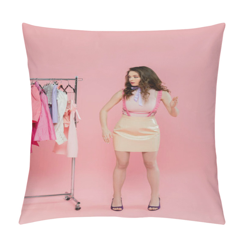 Personality  Wardrobe Selection, Beautiful Young Woman With Wavy Hair Choosing Clothes, Pretending To Be A Doll, Gesturing With Hands While Standing Near Clothes Rack, Pink Background  Pillow Covers