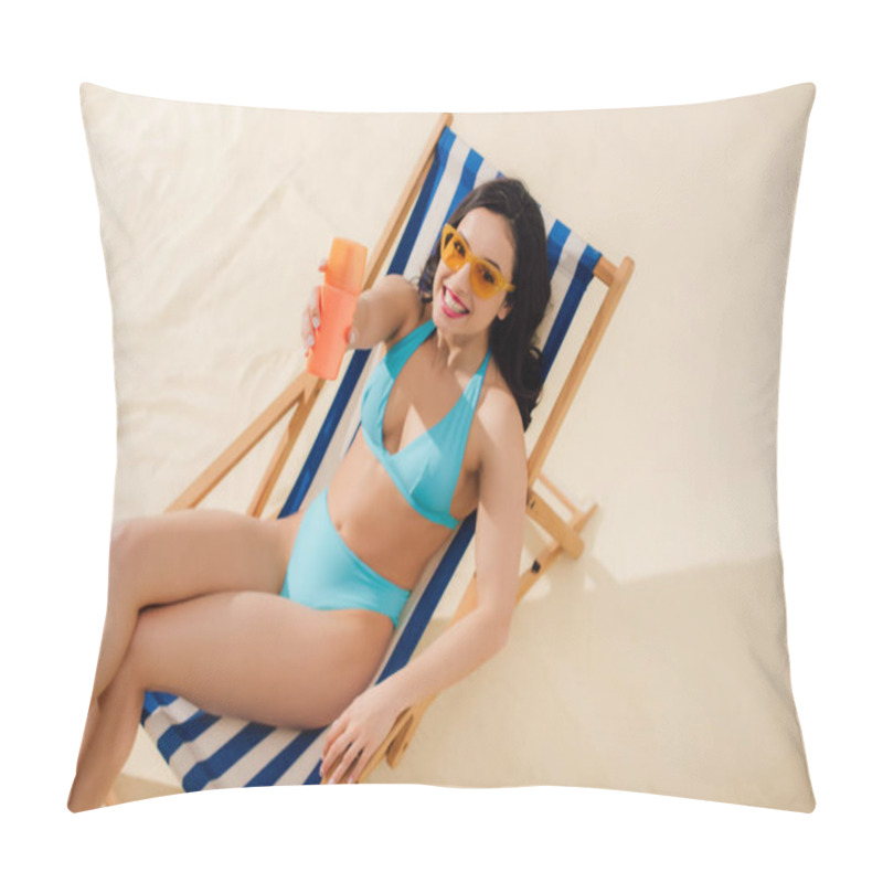 Personality  Beautiful Girl In Sunglasses Holding Sunscreen Bottle, Looking At Camera And Relaxing On Deck Chair On Beach Pillow Covers