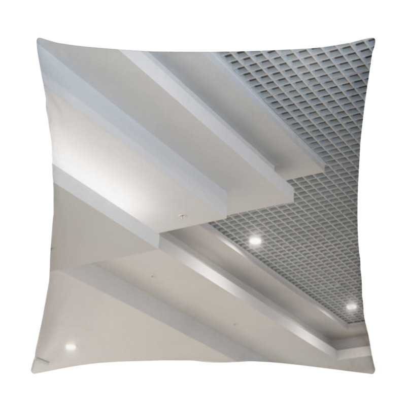 Personality  Suspended And Grid Ceiling With Halogen Spots Lamps And Drywall Construction In Empty Room In Store Or House. Stretch Ceiling White And Complex Shape. Pillow Covers