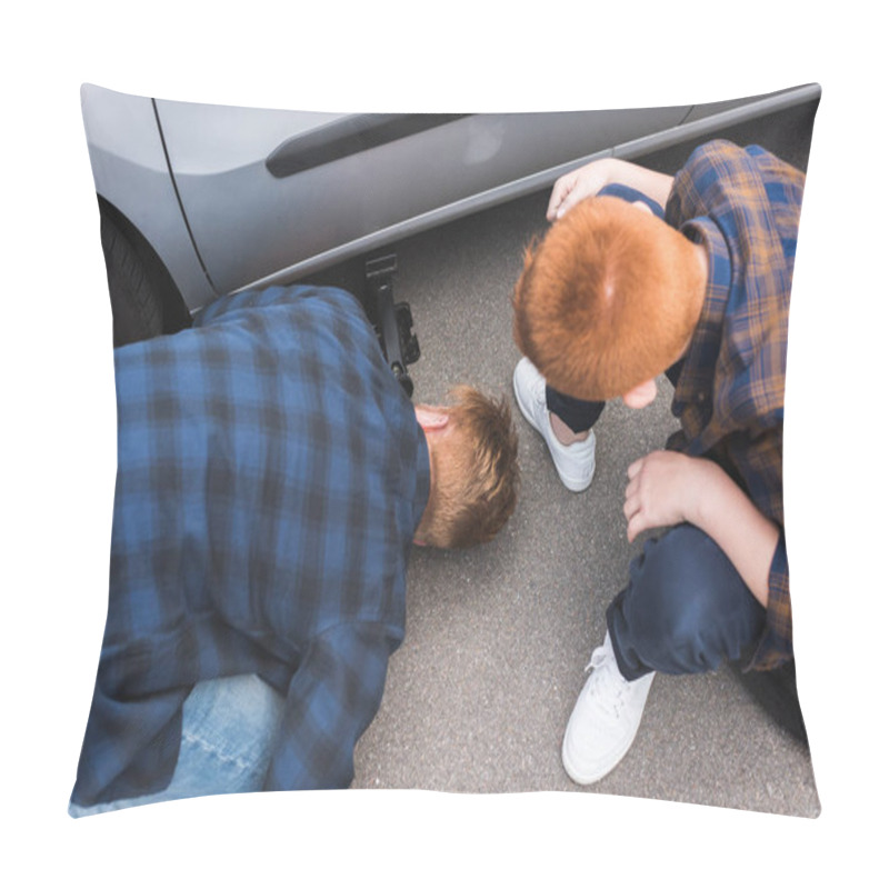 Personality  High Angle View Of Father And Son Lifting Car With Floor Jack For Changing Tire Pillow Covers