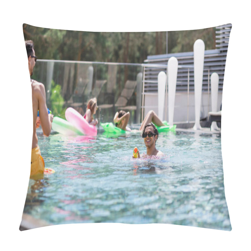 Personality  Multiethnic Men Fighting On Water Guns Near Blurred Women In Swimming Pool Pillow Covers