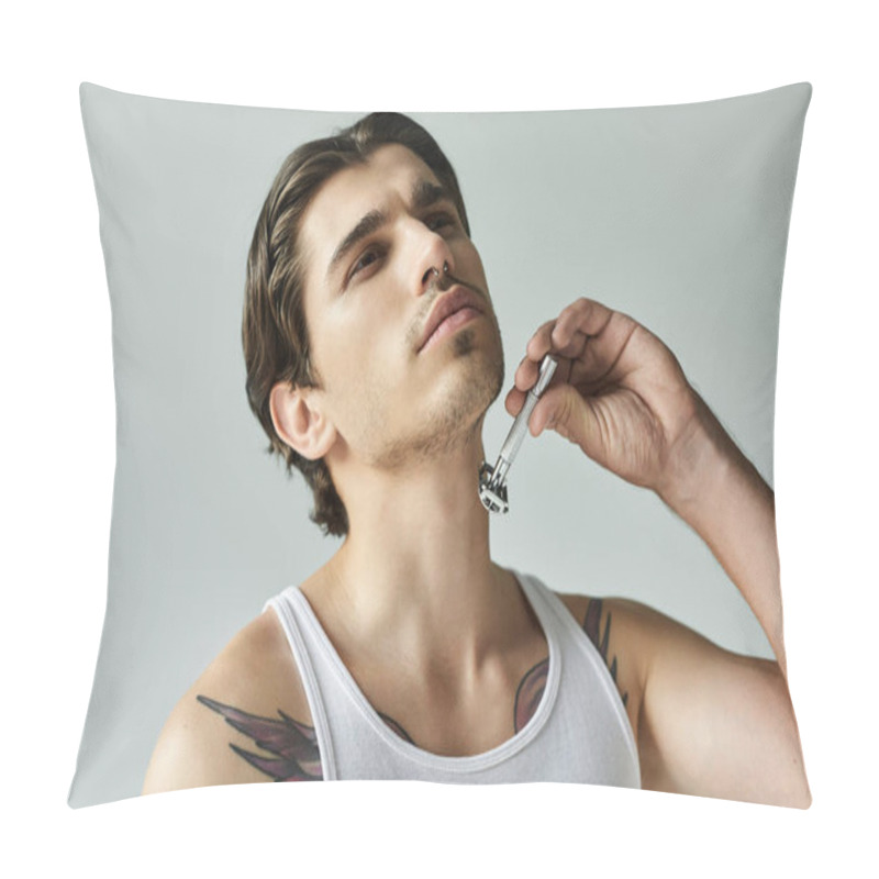 Personality  A Young Man In A Tank Top Delicately Trims His Facial Hair, Revealing Striking Tattoos On His Arms. Pillow Covers