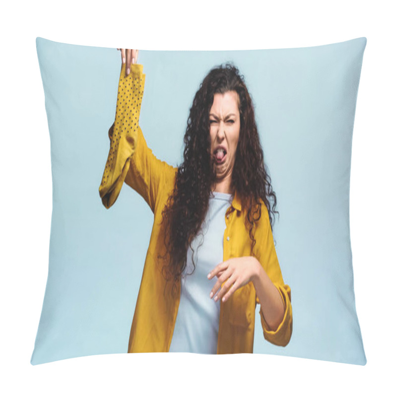 Personality  Curly Woman Grimacing And Sticking Out Tongue While Holding Smelly Socks Isolated On Blue Pillow Covers