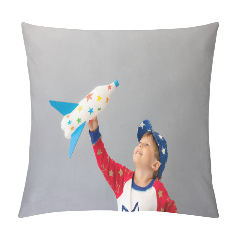 Personality  Happy Child Playing With Toy Rocket Against Concrete Wall Background. Kid Pretend To Be Astronaut. Imagination And Children Dream Concept Pillow Covers