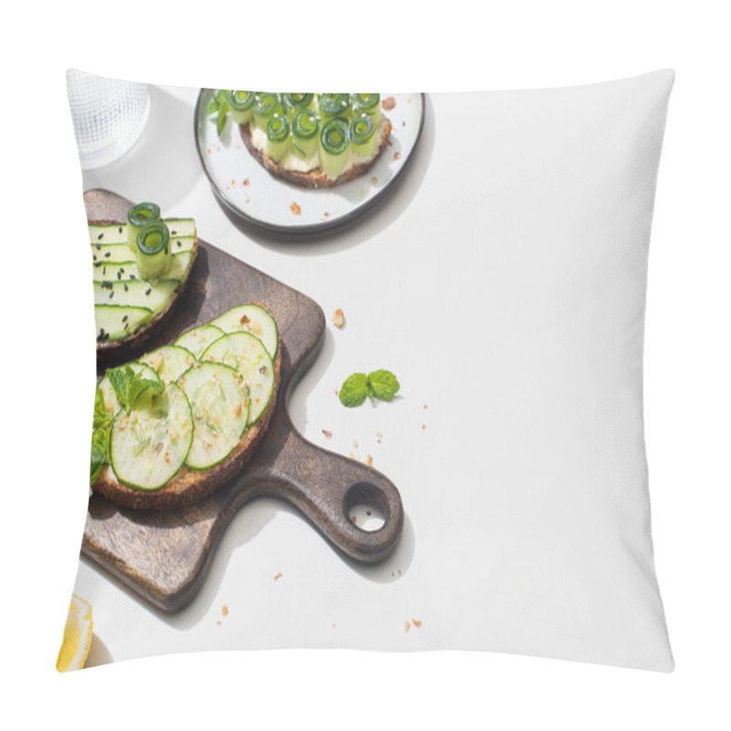 Personality  Fresh Cucumber Toasts On Wooden Cutting Board Near Water And Lemon On White Background Pillow Covers