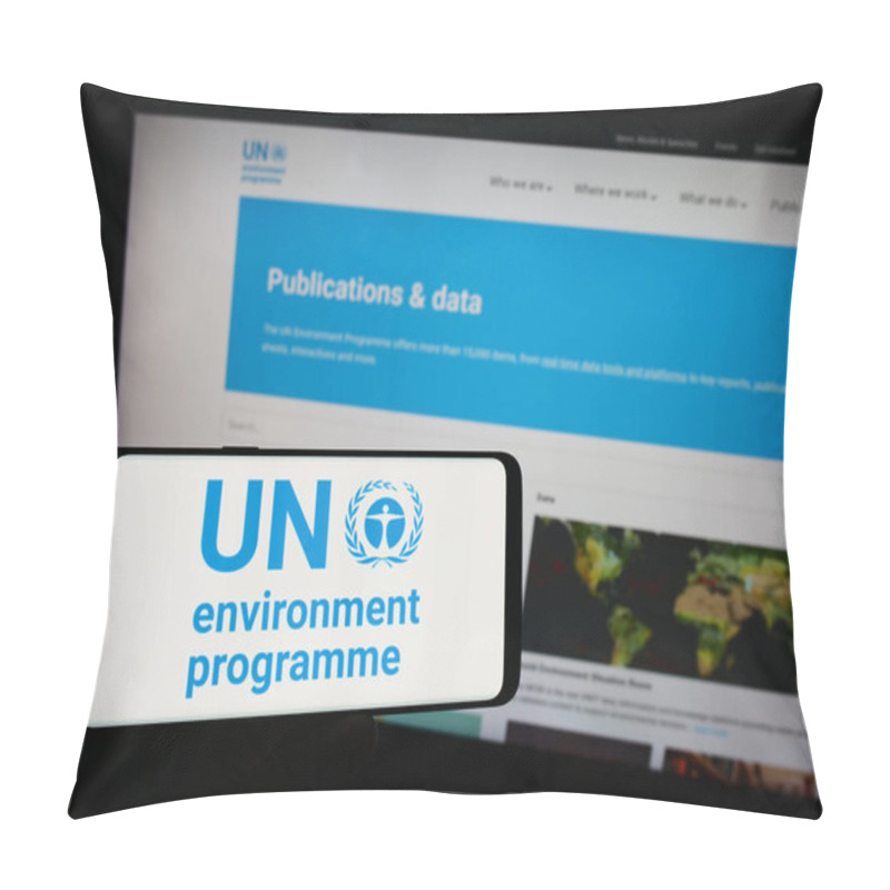 Personality  Stuttgart, Germany - 07-27-2023: Person Holding Mobile Phone With Logo Of United Nations Environment Programme (UNEP) On Screen In Front Of Web Page. Focus On Phone Display. Pillow Covers