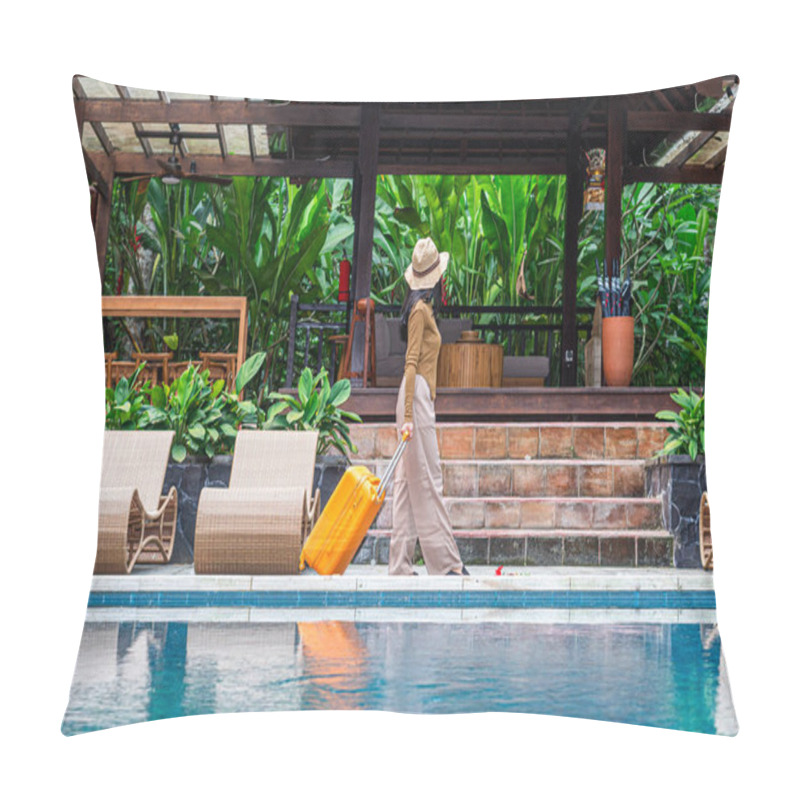 Personality  A Woman Walking By A Poolside With An Orange Suitcase, Wearing A Hat And Stylish Outfit. The Background Features Lush Greenery And A Wooden Structure, Creating A Tropical Vacation Vibe. Pillow Covers