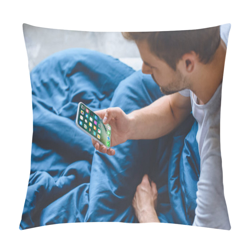 Personality  Selective Focus Of Young Man Using Iphone At His Bed At Home  Pillow Covers