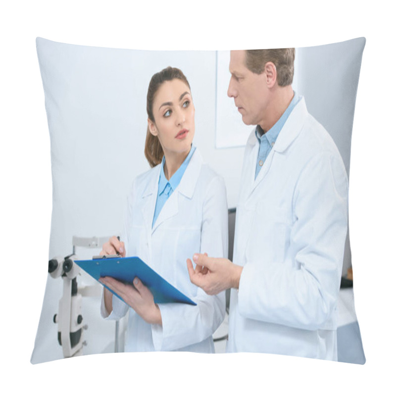 Personality  Male And Female Ophthalmologists Writing Diagnosis In Clinic Pillow Covers