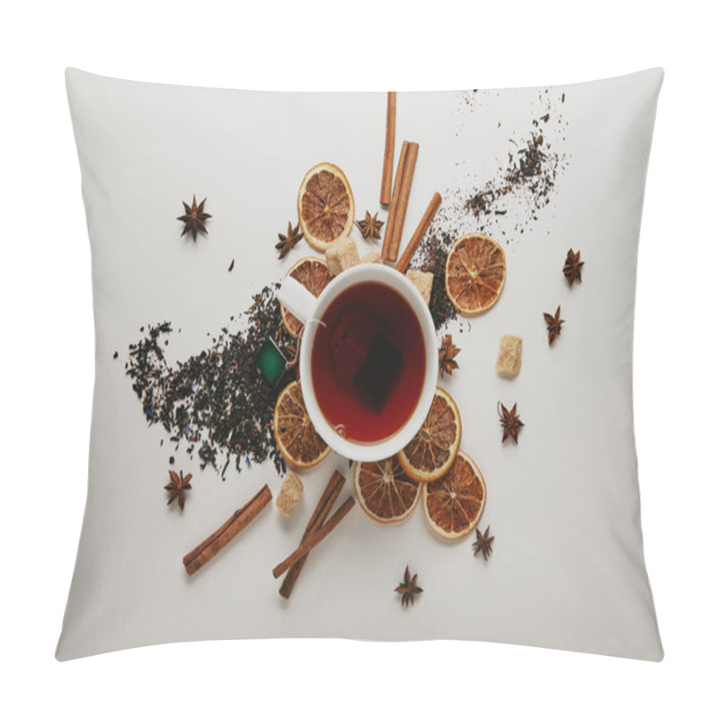 Personality  Flat Lay With Arranged Cinnamon Sticks, Anise Stars, Dried Orange Pieces And Cup Of Hot Tea On White Background Pillow Covers