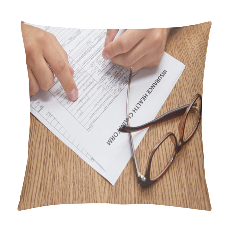 Personality  Close-up Partial View Of Person Signing Insurance Form At Wooden Table With Eyeglasses  Pillow Covers