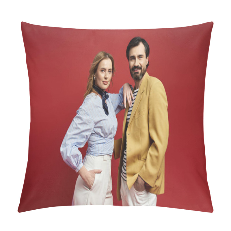 Personality  A Stylish Couple Stands Poised Against A Bold Red Backdrop, Expressing Elegance And Charm. Pillow Covers