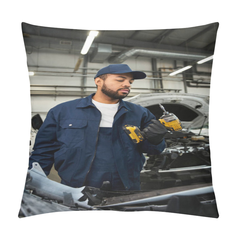 Personality  Focused Young Mechanic Holds Power Tools While Inspecting A Car In A Well Lit Workshop Environment Pillow Covers