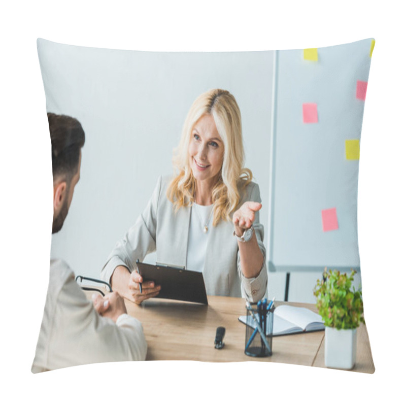 Personality  Selective Focus Of Cheerful Woman Holding Clipboard And Gesturing Near Employee  Pillow Covers