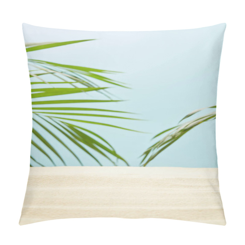 Personality  Selective Focus Of Golden Sandy Beach Near Green Palm Leaves On Blue Pillow Covers