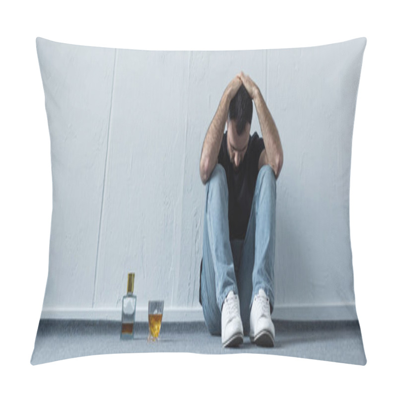 Personality  Panoramic Shot Of Suffering Man Sitting On Floor By White Wall Near Bottle And Glass Of Whiskey Pillow Covers