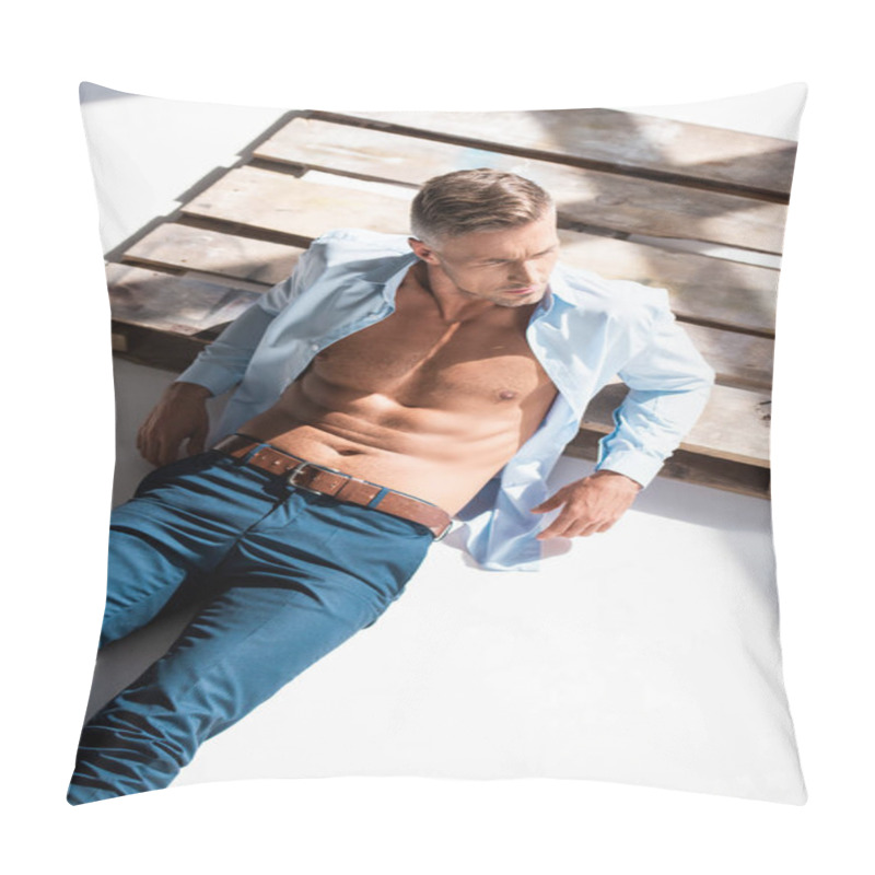 Personality  High Angle View Of Sexy Man With Unbuttoned Shirt Lying On Wooden Pallet On White And Looking Away Pillow Covers