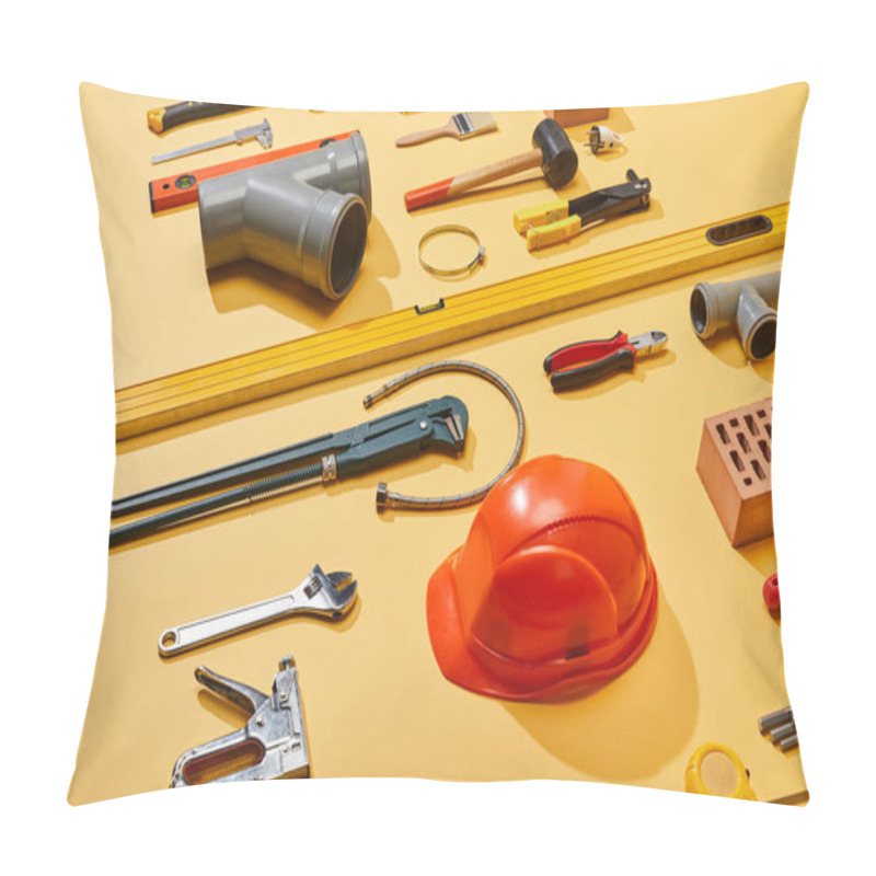 Personality  High Angle View Of Industrial Tools, Helmet, Bricks, Measuring Tape, Brush, And Plumbing Hose On Yellow Background Pillow Covers