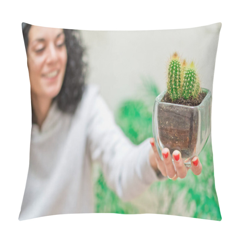 Personality  Smiling Young Woman Holding A Glass Pot With A Cactus Planted In Her Home Garden. Selective Focus. Gardening, Plant Care And Decoration Concept. Pillow Covers