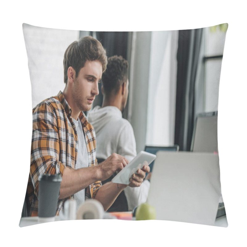 Personality  Thoughtful Programmer Using Digital Tablet While Sitting At Workplace Near African American Colleague Pillow Covers