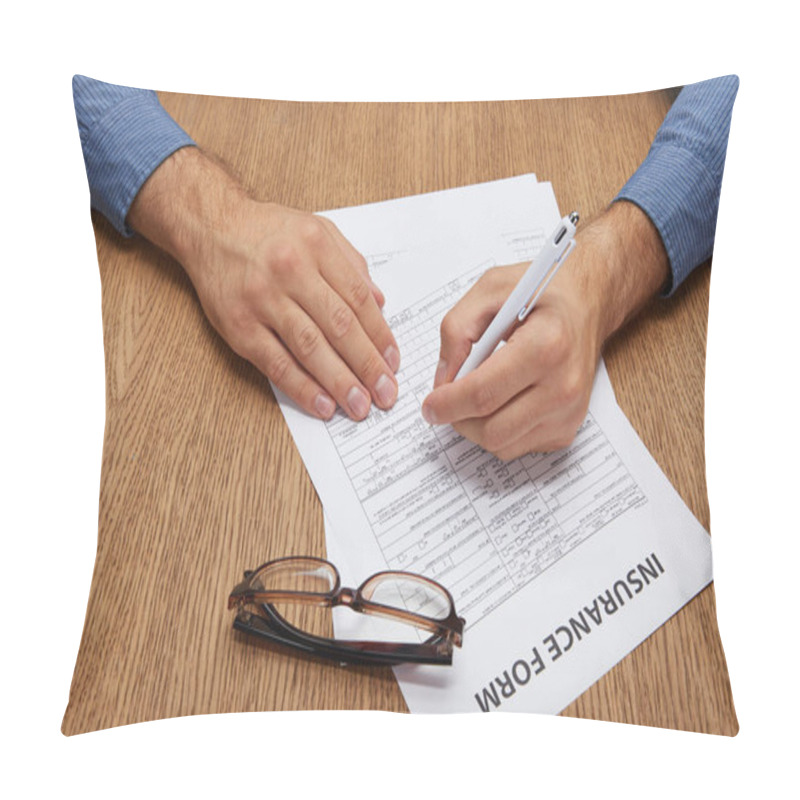 Personality  Cropped Shot Of Person Signing Insurance Form At Wooden Table With Eyeglasses  Pillow Covers