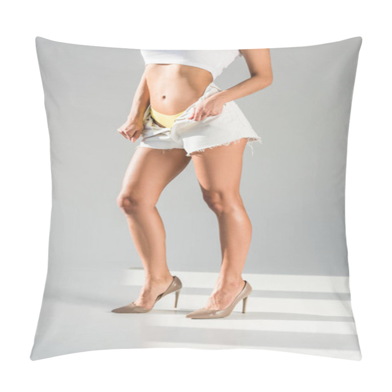 Personality  Cropped View Of Woman In High-heeled Shoes Unzipping Shorts On Grey Background Pillow Covers