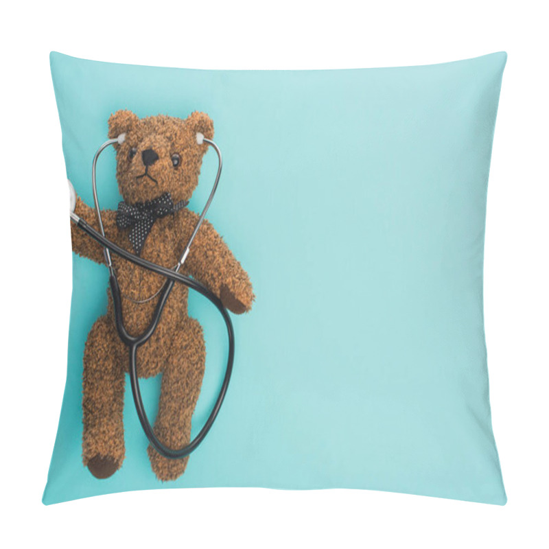 Personality  Top View Of Brown Teddy Bear With Stethoscope On Blue Background, International Childhood Cancer Day Concept Pillow Covers