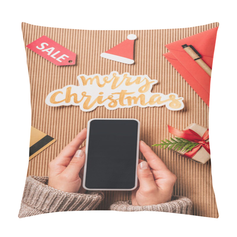 Personality  Cropped Image Of Woman Holding Smartphone With Blank Screen Over Surface With Credit Card, Gift Box And Merry Christmas Lettering  Pillow Covers