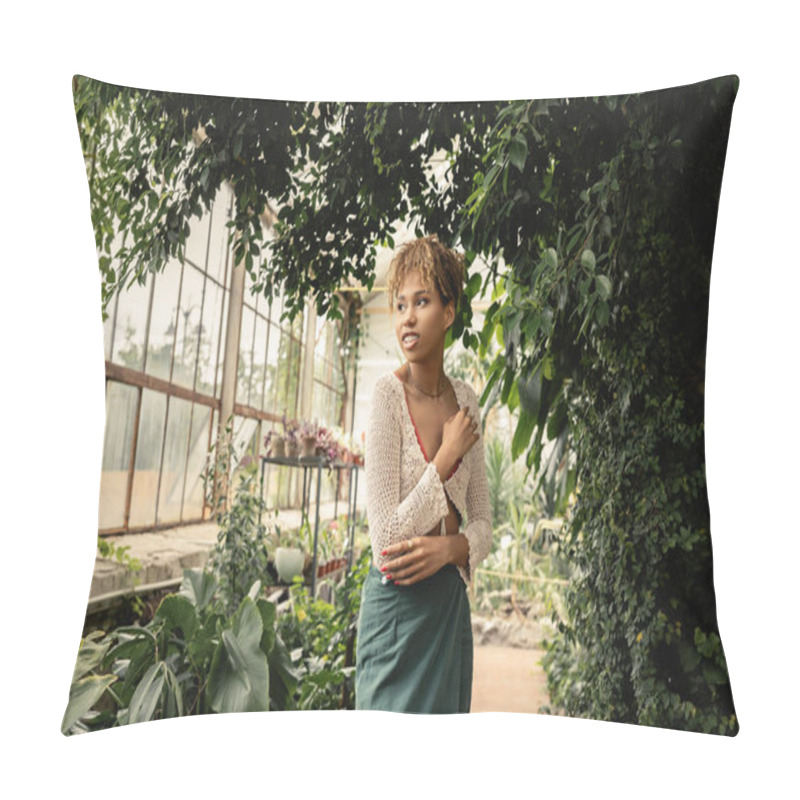 Personality  Smiling And Trendy Young African American Woman In Summer Knitted Top And Skirt Looking Away While Standing Near Green Plants In Garden Center, Stylish Woman Enjoying Lush Tropical Surroundings Pillow Covers