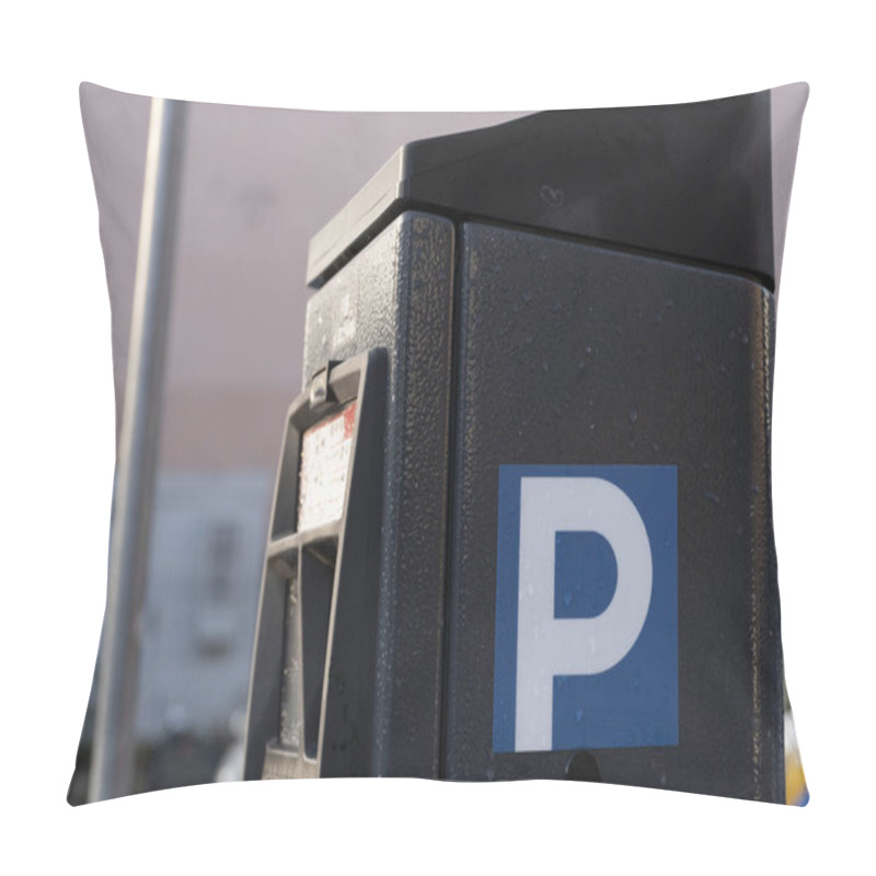 Personality  A Closeup View Of A Modern Parking Meter With A Blue P Sign On Its Side. The Surface Is Covered In Water Droplets, Emphasizing Its Outdoor Location. The Blurred Background Features Urban Elements. The Pillow Covers