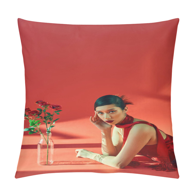 Personality  Spring Fashion Concept, Young Asian Woman With Brunette Hair And Bold Makeup Laying In Neckerchief And Dress While Looking At Camera Near Fresh Roses On Red Background With Lighting Pillow Covers