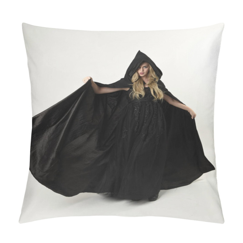 Personality  Full Length Portrait Of Blonde Girl Wearing Long Black Flowing Cloak, Standing Pose  With  A White Studio Background. Pillow Covers