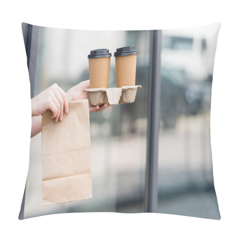 Personality  Cropped View Of Waitress Holding Paper Bag And Coffee To Go Near Cafe On Urban Street  Pillow Covers